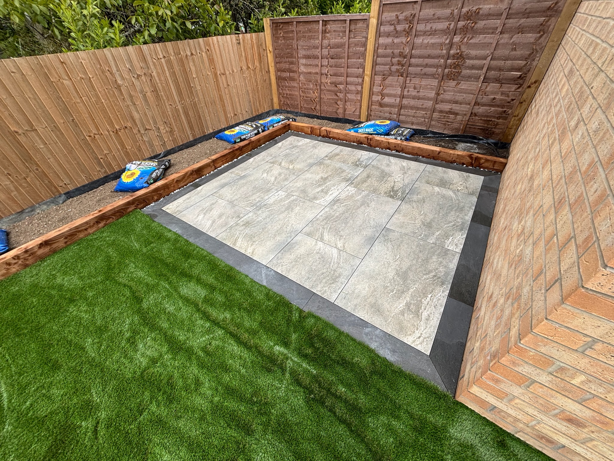 Earthcore Grey Porcelain Patios with Artificial Grass finished photo 3