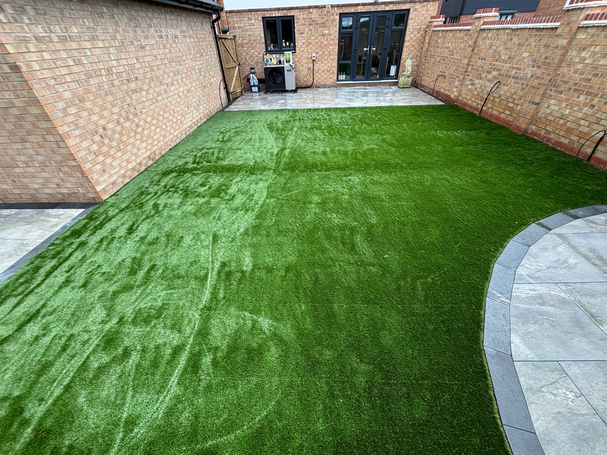 Earthcore Grey Porcelain Patios with Artificial Grass finished photo 4