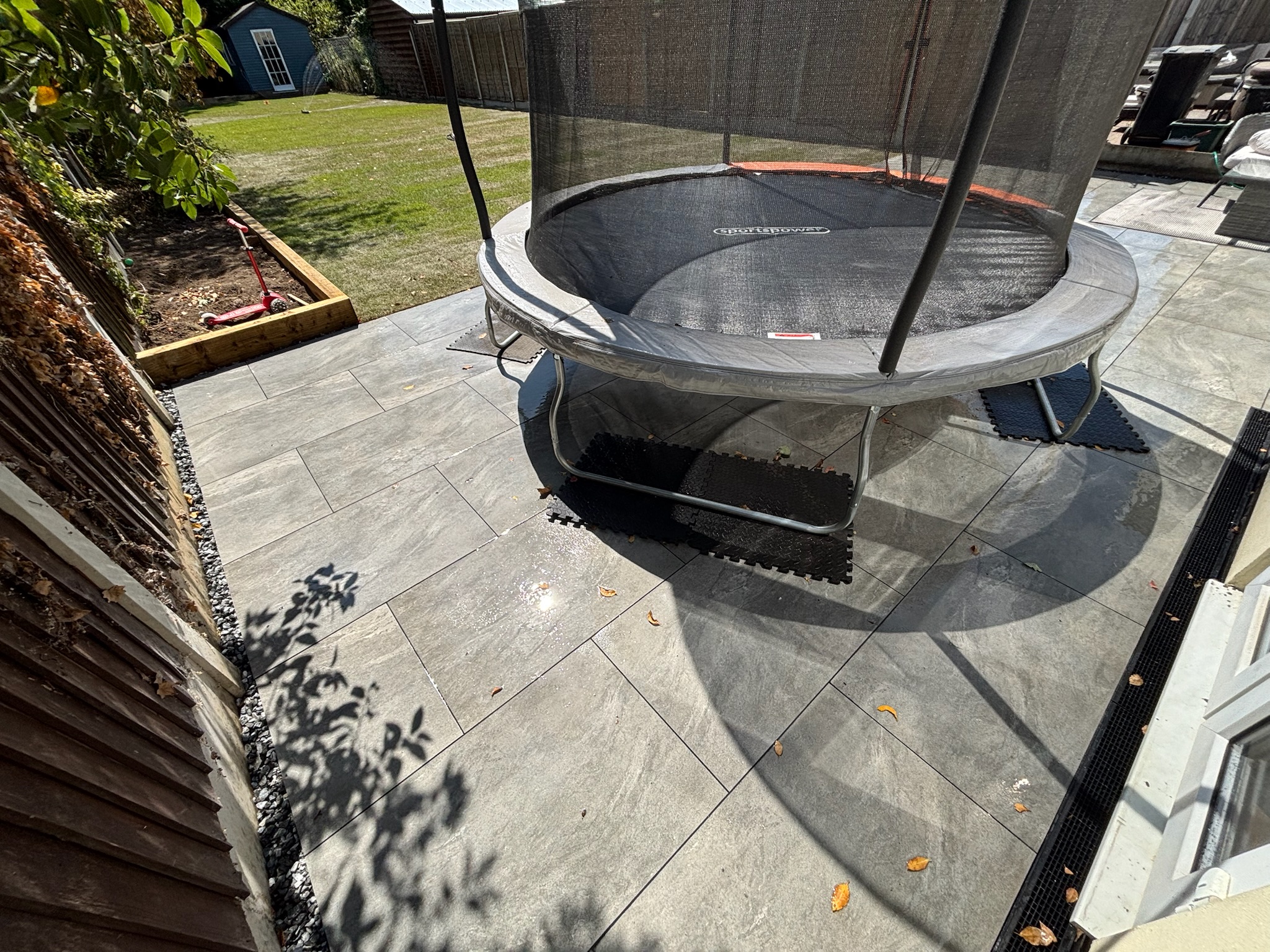 Mercury Porcelain Patio with Raised Sleeper Planters & Natural Turf